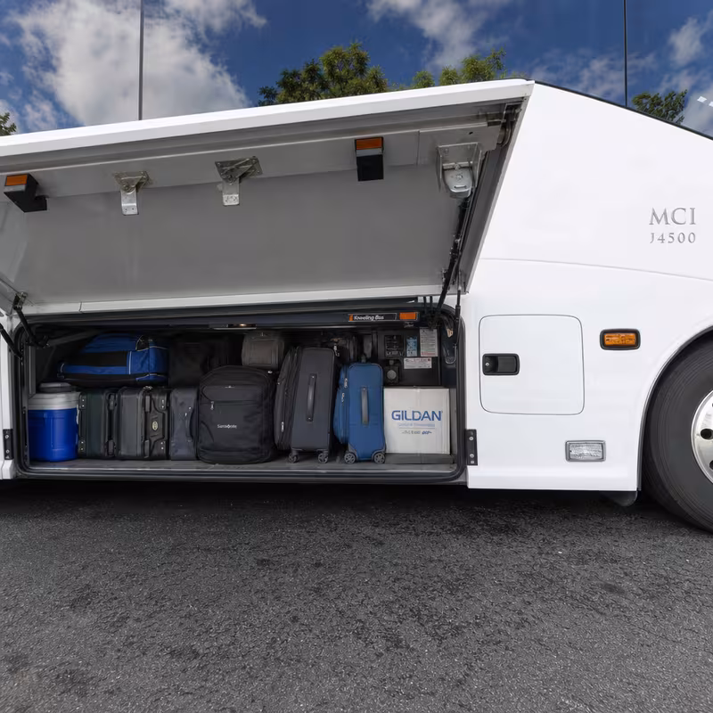 Party bus interior with wraparound leather seating and LED lighting in San Jose
