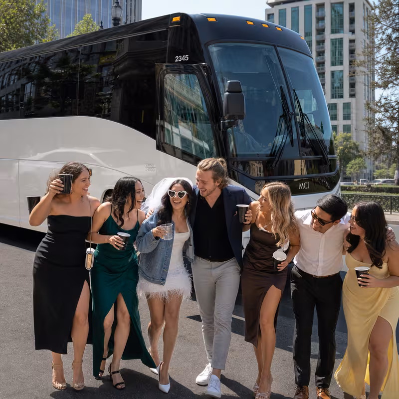 Passengers loading luggage while boarding an San Jose group shuttle