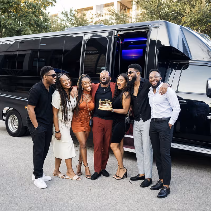 Group boarding a white charter bus for Birthday Transportation transportation in San Jose