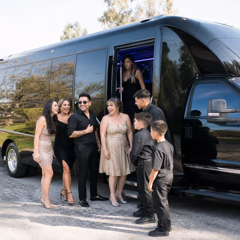 Passengers loading luggage while boarding an San Jose group shuttle