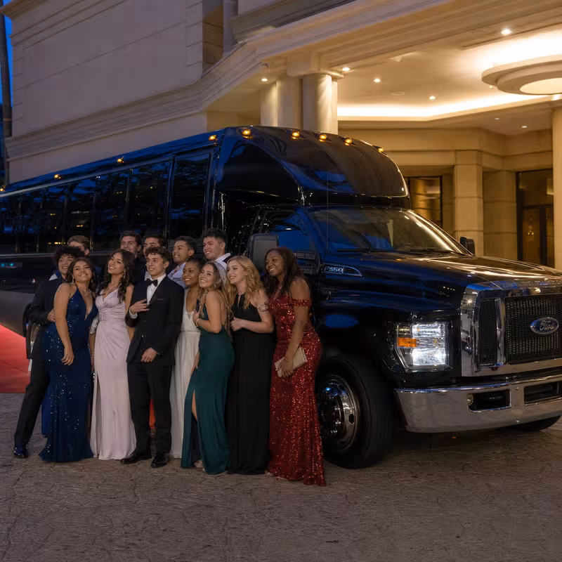 Party bus interior with wraparound leather seating and LED lighting in San Jose