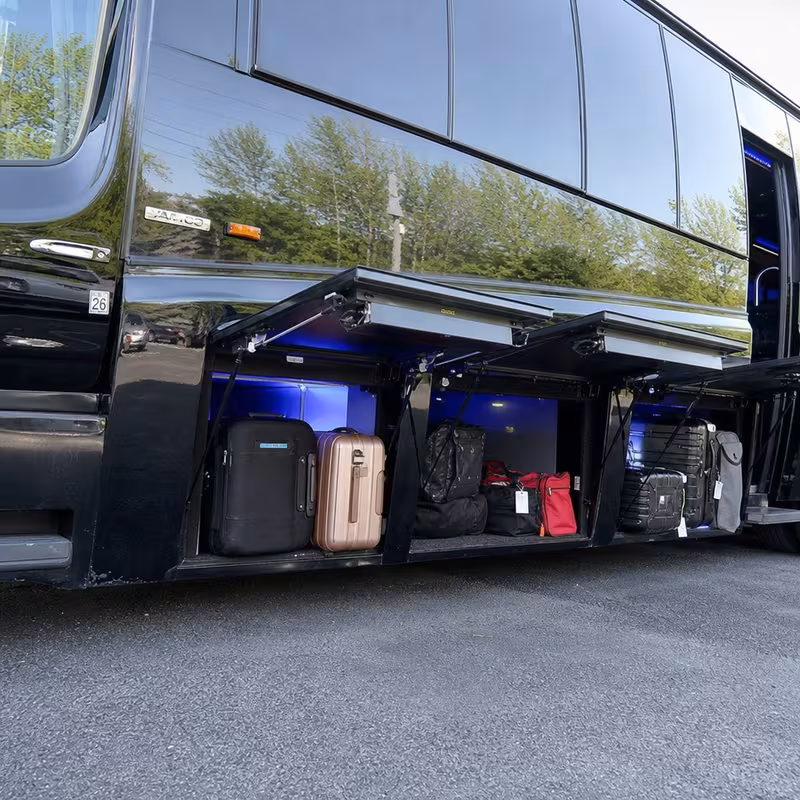 Party bus interior with wraparound leather seating and LED lighting in San Jose