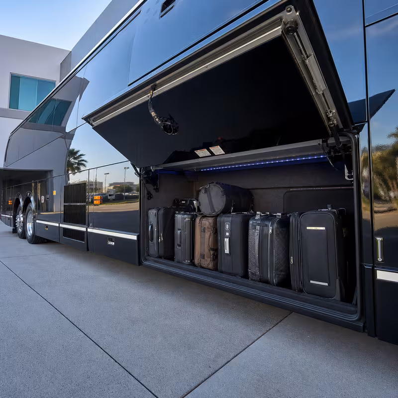 Party bus interior with wraparound leather seating and LED lighting in San Jose