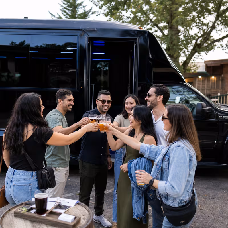 Passengers loading luggage while boarding an San Jose group shuttle